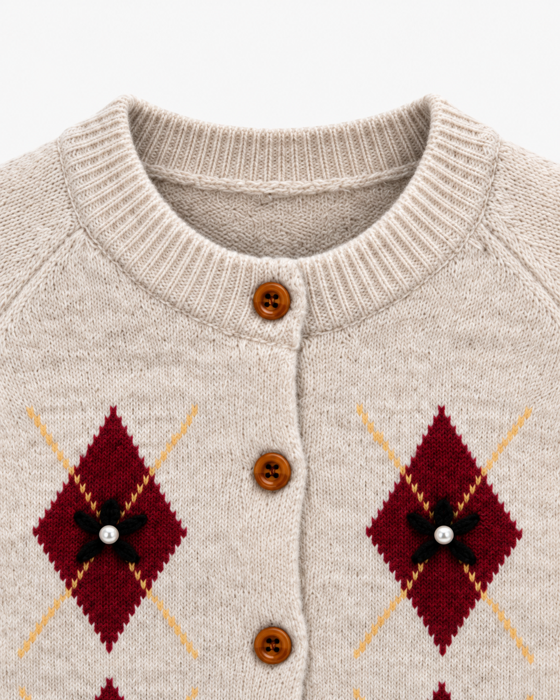 Chaqueta de punto con rombos y perlitas