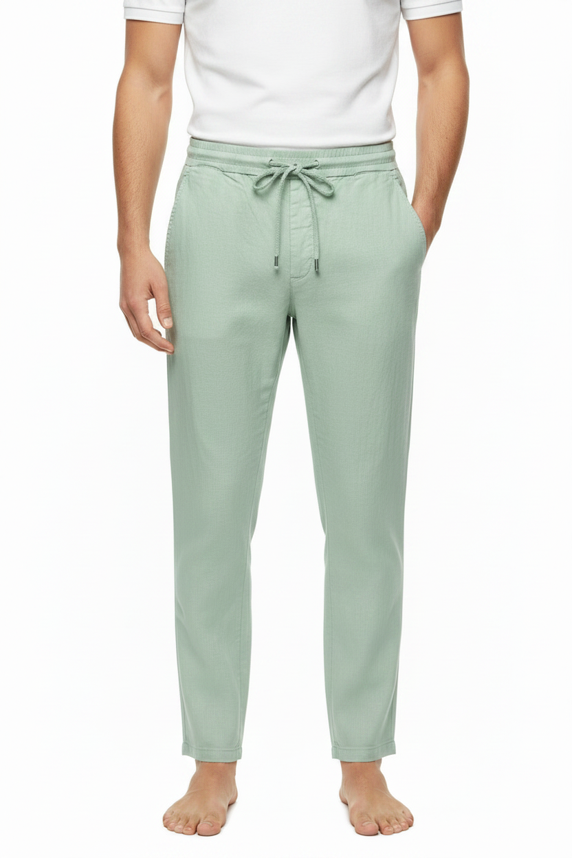 Pantalón lino verde agua con polo blanco